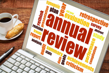 annual review word cloud on laptop