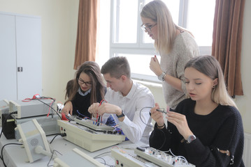 Group of young students in technical vocational training with teacher, the lesson in technical college. © as-artmedia
