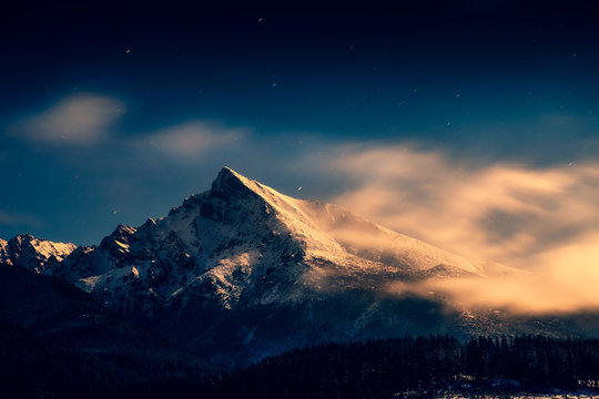 Night time landscape view of mountain peak Krivan with moonlight, High Tatras, Slovakia