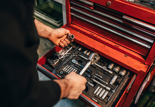 Mechanic choosing tools in the workshop