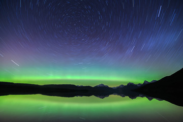 Star Trails and the Aurora Borealis Over Lake McDonald