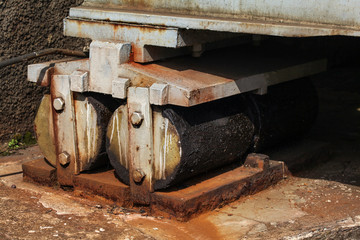 Rollers at the end of the railway bridge, for thermal expansion compensation.