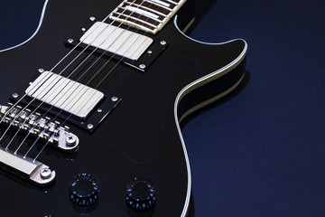 Black electric guitar for background, music studio