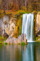 Fototapeta na wymiar Beautiful Waterfall in awesome autumn day, Plitvice, Croatia
