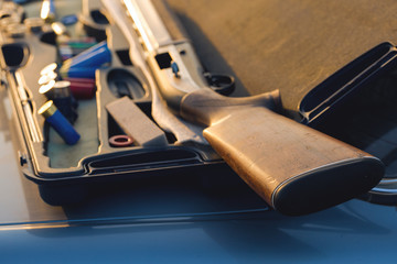 A gun on the trunk of a car, Detention of criminal weapons  © Mountains Hunter