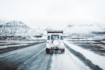 car on winter road in Iceland