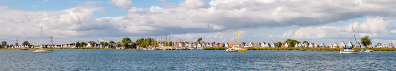 Fototapeta na wymiar Skyline of dike village Durgerdam with old houses and boats, IJmeer, Amsterdam, Netherlands