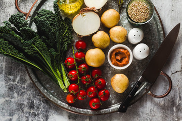 background of food ingredients on a tray. healthy food. full vegetable food on gray background