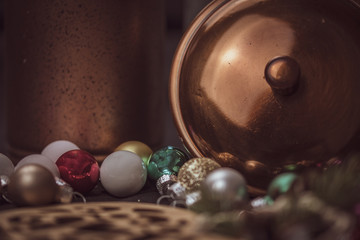 Christmas tree baubles and decoration - with copy space - rustic copper background. 