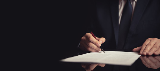 Lawyer, attorney signing a contract