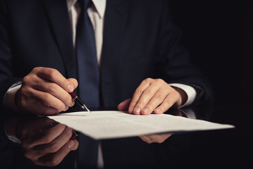 Lawyer, attorney signing a contract