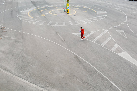 Sportsman walking on parking lot