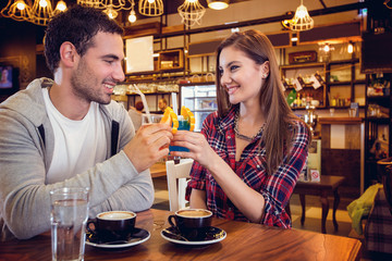 couple toasting with cocktails