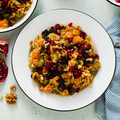 Delicious autumn festive salad of pumpkin, brussels sprouts, quinoa, walnuts, caramelized onions...