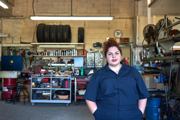 Portrait of Female Car Mechanic in Her Shop