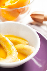 Fried bananas in orange sauce, a delicious dessert from fruits, butter and cognac.