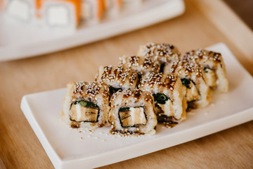 Philadelphia roll sushi cucumber, avocado, cream cheese, red caviar. Sushi menu