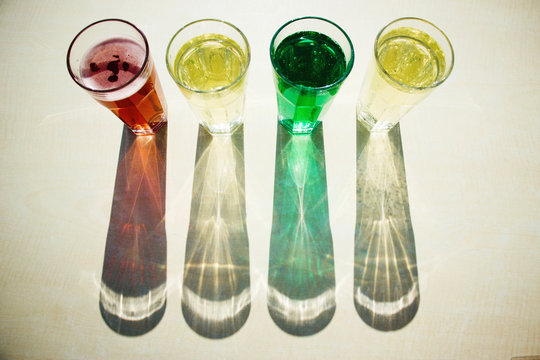 Overhead view of colorful lemonade drinks served in glass