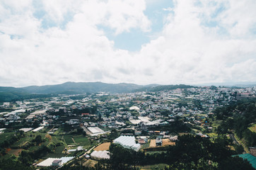 Obraz premium Dalat city, Vietnam, View of many houses from hill, The architecture of Dalat, Cityscape, Panorama landscape. a Lat (Dalat) is famous for its wide variety of flowers, vegetables and fruit.