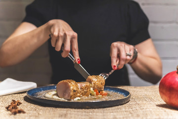 Woman eating rolled meat