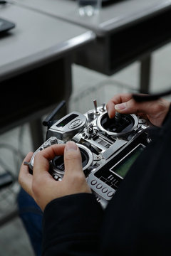 close-up of hand holding UAV remote control