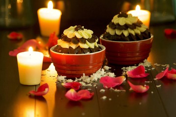 candles and flowers with chocolate