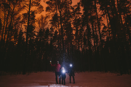 Family playing with flashlights