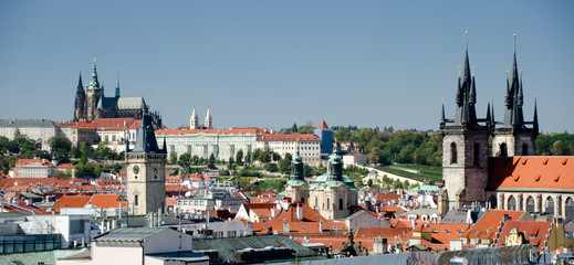 Fototapeta na wymiar Roofs and churches of Prague