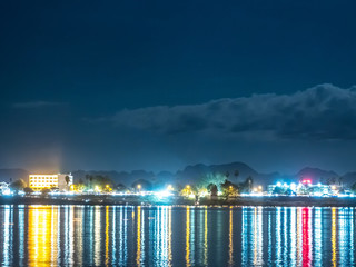 Riverside town at night