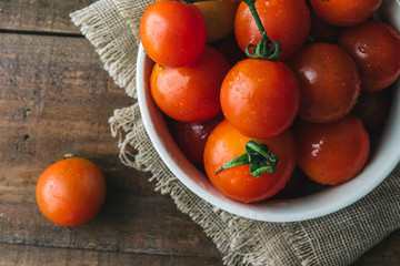 Cherry tomato on wooden background