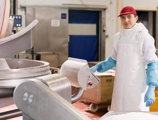 Man working at modern meat factory