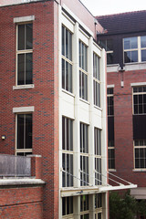 Ancient brick building structure with ivory white framing