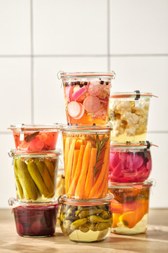 Still life of pickled vegetables on table.