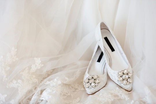 White wedding dress and white wedding shoes
