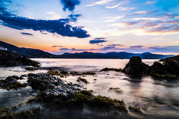 Moving water at sunset at sea