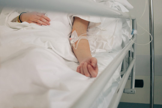 Young woman in a hospital bed after chirurgy