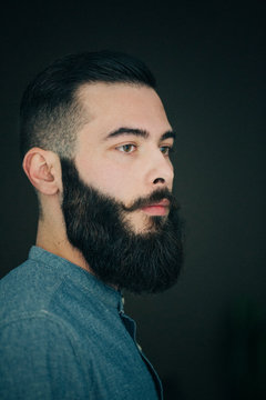Serious bearded man looking at camera