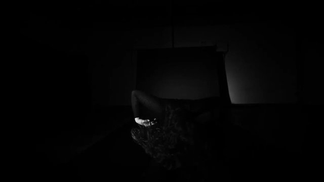 Slow motion shot of painful, hurt and protective movement dancer by contemporary dancer