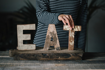 Carved word Eat from wood