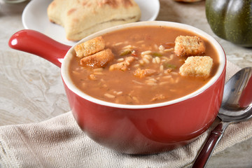 Cup of chicken gumbo soup with rice