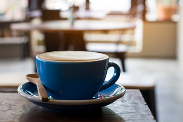 cup of coffee on wooden table, morning breakfash