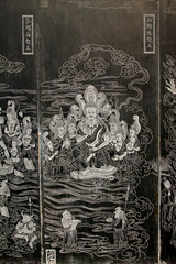 Exquisite statues carved on the black marble in Jijue Temple, China