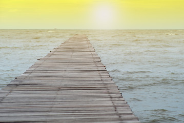 Fototapeta premium Abstract texture and background of wooden walkway into the sea. Wood bridge at the shore into the ocean