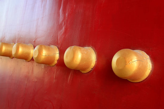 doornail on red palace door