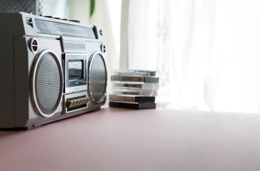 Retro 1980s ghetto blaster radio cassette player with cassette tapes