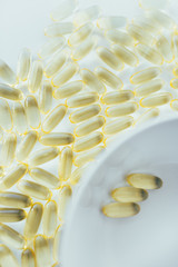 Close up of capsules Omega 3 on white background. Top view