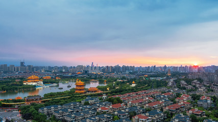 The urbanization process of ancient Chinese city of Xi'an, ancient architecture, modern residential buildings, beautiful lakeside