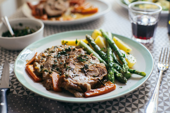 Sliced rosemary roast with grilled vegetables, red wine and dressing