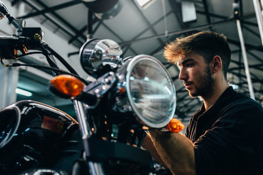 Mechanic working in the motorbike workshop