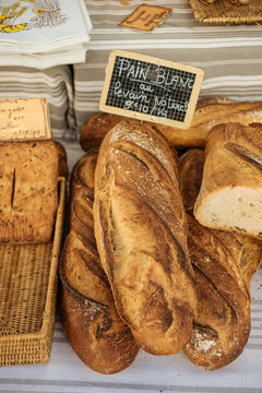 Fresh traditional french bread selling on a marketplace